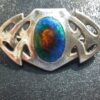 Archibald Knox, designed for Liberty & Co, Art Nouveau silver and enamel  brooch, marked for John Baker Bennett & Co, circa 1908 SOLD