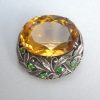 Bernard Instone, Arts and Crafts citrine and demantoid garnet brooch, England, circa 1930 SOLD
