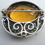 Bernard Instone, Arts and Crafts citrine and demantoid garnet brooch, England, circa 1930 SOLD - Image 2