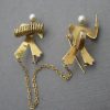 Freddie Manshaw Ltd (attributed), 9 carat gold and simulated pearl musicians brooch, London 1948 SOLD