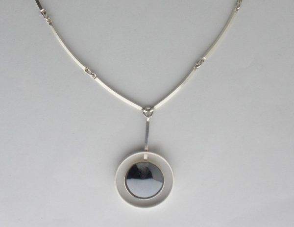 Niels Erik From, hematite set silver pendant on chain, Denmark, circa 1972 SOLD