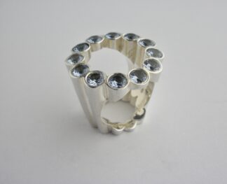 Aremo of Mauritius, blue cubic zirconia set heavy silver 'Halo' ring, 2007 (Ref S716) SOLD