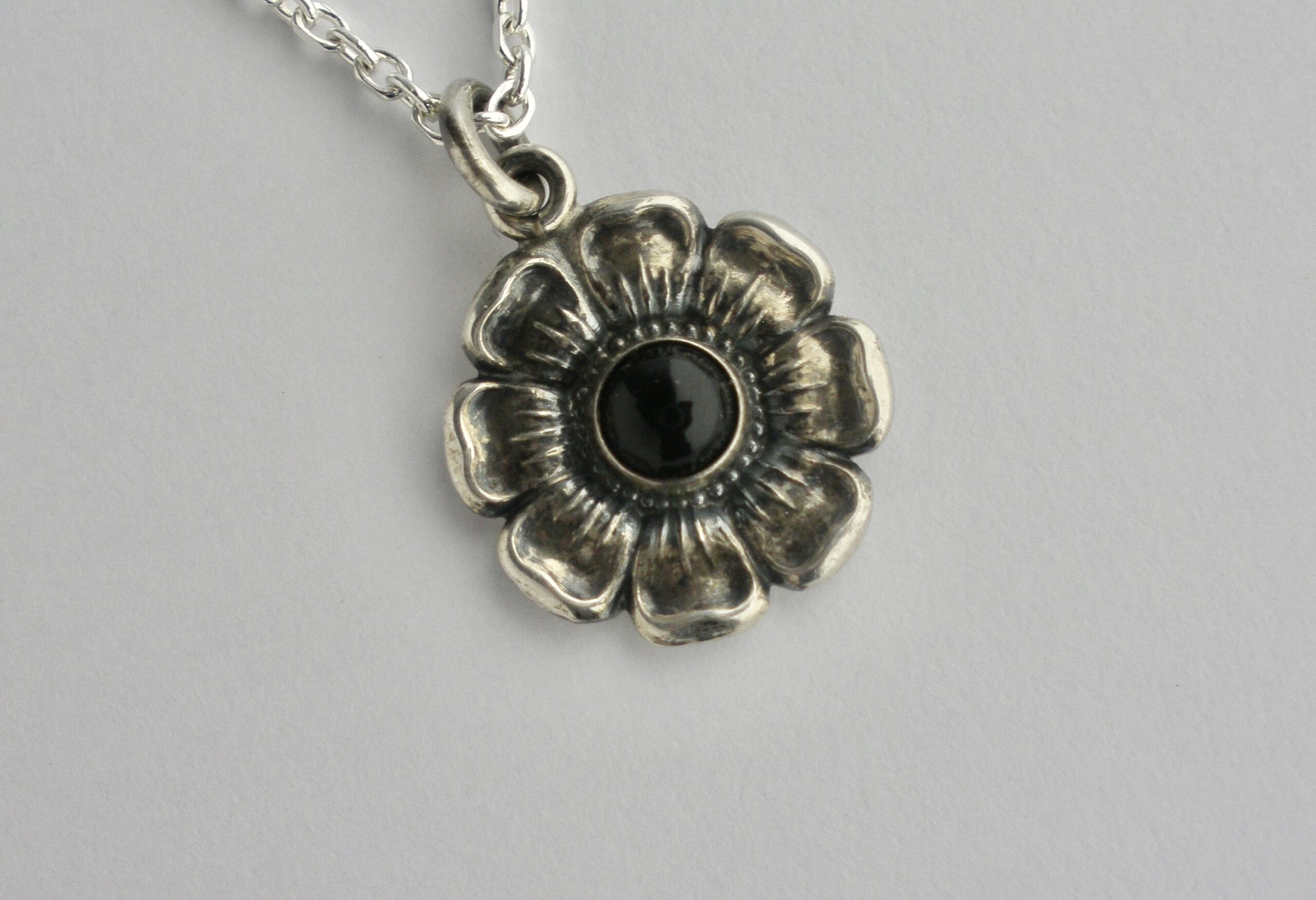Niels Erik From, black onyx set silver flower head pendant on a chain ...