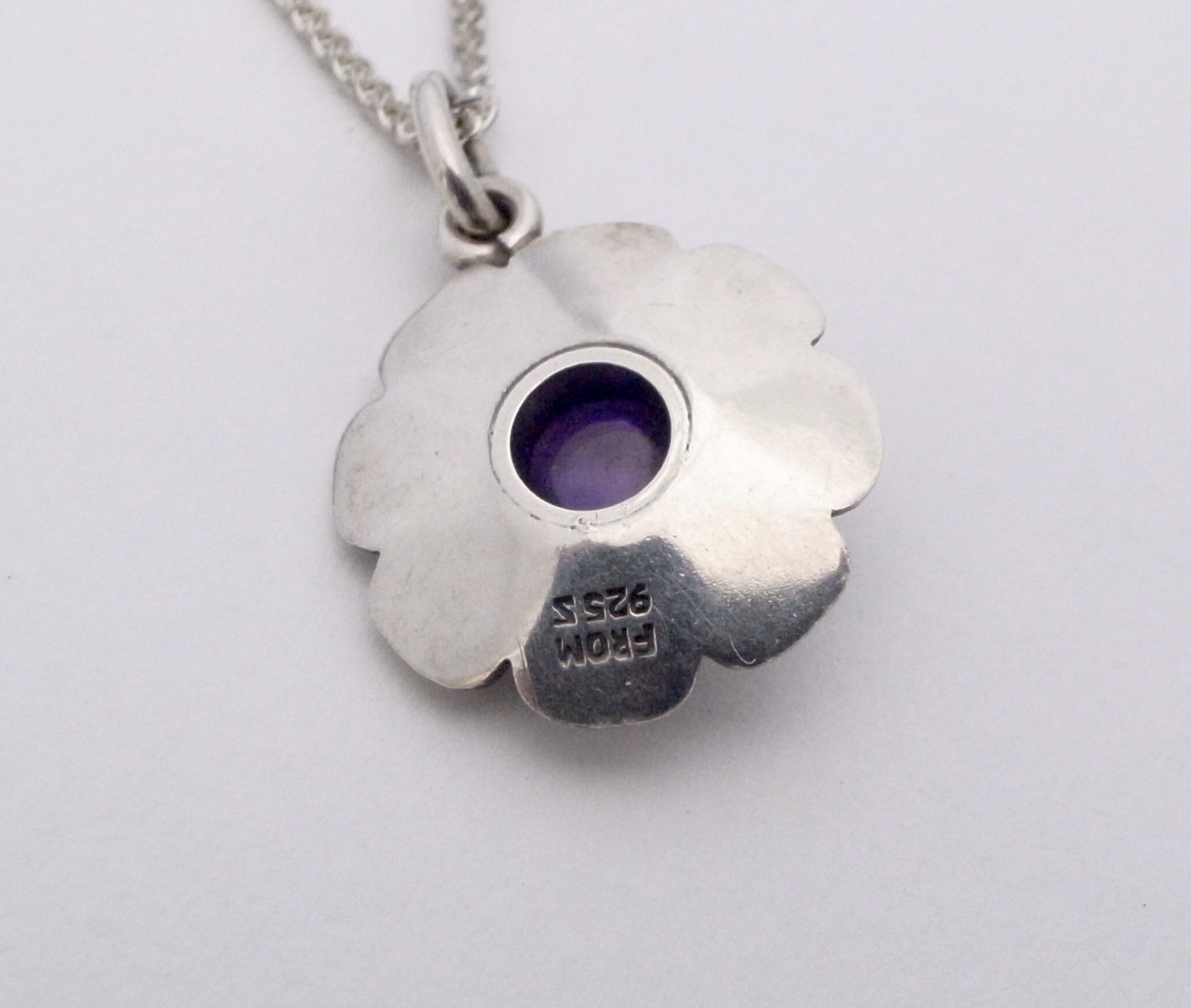 Niels Erik From, amethyst set silver flower head pendant on a 