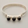 Martti Viikinniemi (attributed), three stone cabochon set 830 standard silver bangle, Finland, circa 1975 (ref S+469)