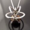 Elis Kauppi for Kupittaan Kulta, tiger eye silver spherical cage pendant on chain, Finland, circa 1975 (Ref S+653) SOLD - Image 3