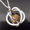 Elis Kauppi for Kupittaan Kulta, tiger eye silver spherical cage pendant on chain, Finland, circa 1975 (Ref S+653) SOLD - Image 5