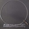 Maker unknown, mixed metal pendant on a wire neck ring, retailed by Diana Porter, Contemporary Jewellery Gallery, Bristol, possibly by SIM of Germany?, circa 2010 (Ref S+670) SOLD