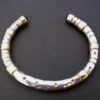 Michael Allen Bolton, garnet set gold and silver torque bangle, London 2000 (Ref S+904) SOLD