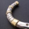 Michael Allen Bolton, garnet set gold and silver torque bangle, London 2000 (Ref S+904) SOLD - Image 6