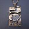 Jorma Laine for Turun Hopea (probably), abstract modernist bronze pendant on chain, Finland, circa 1975 (Ref S+843)