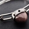 Martti Viikinniemi (attributed), 'goldstone' cabochon set 830 standard silver bangle, Finland, circa 1975 (ref S+961) - Image 5