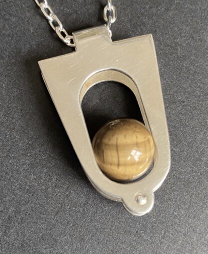 Kultaseppa Salovaara, kinetic tiger eye set silver pendant on a chain, Finland, circa 1970 (Ref S+978) SOLD
