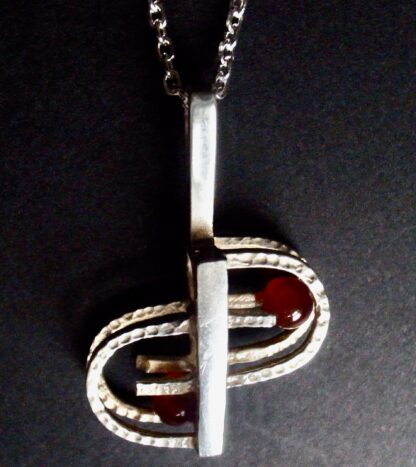 Unknown, silver and carnelian two bead kinetic pendant on chain, Denmark, circa 1975 (Ref S+976)