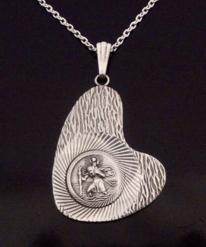 Excalibur Jewellery Limited, asymmetrical silver Saint Christopher pendant on a chain, Birmingham 1978 (Ref S+2029HH)